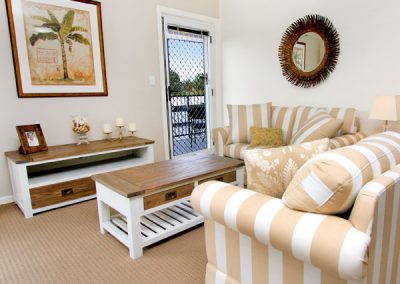 a living room filled with furniture and a coffee table